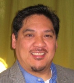 close up headshot of a smiling person
